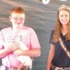 Walker Deters shows off his duck with the Miss Lewis County fair during events held last week. The duck received Grand Champion Other Poultry division.
