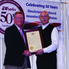 State Representative Craig Redmon presented a resolution to Joe Charles commemorating 50 years of service.