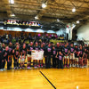 The Highland Cougars and Highland Lady Cougars presented a check to Sarah Degarmo and family during pink night at Highland on Feb.7.