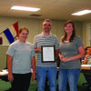 Canton Mayor Jarrod Phillips presents a proclamation to Aron Knocke and Crystal Bell of A and C Paint Studio.