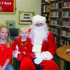 Addie and Mabrie Lay tell Santa what they would like for Christmas.