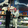 Dr. Alissa Burger presents the Plein Air Poetry blue ribbon to Dr. Patrick Lane for his poem Signs of Life at the Canton Public Library on October 12.