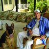 Jim Nabors, famous for his character Gomer Pyle, with his dog Jimbo at their home in Hawaii.