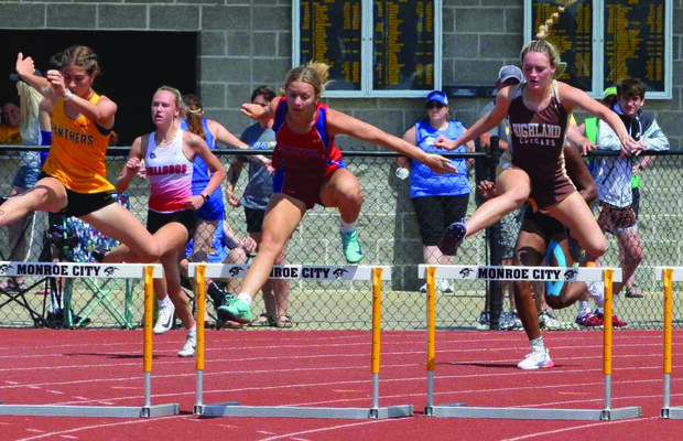 Ansley Bringer competing in the 300 meter hurdles.