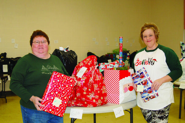 Judy Eaton and Stephanie Stein at the Adopt a Family Christmas give away in 2017.