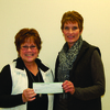 Maxine Hark receives a check on behalf of the Canton Council of Churches Food Pantry from Brenda Wright of Ursa Farmers Coop.