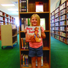 Lucy B won a new book on her first trip to the LaGrange Library while visiting her grandparents, John and Vicki Stiffey. Prizes are still available to children who complete reading slips before school starts.