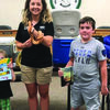 A total of 45 children and adults attended the Summer Reading Program at the LaGrange Library.   Mallory Machir from Blank Park Zoo is pictured with Owen Harlan and Austin Weaver, winners of the book give away on July 25.