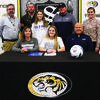 Smith-Cotton High School senior Megan Toops has signed a letter of intent to play soccer at State Fair Community College in Sedalia. Seated with her are her parents, Kim and Rob Toops; back, from left: S-C Principal Wade Norton, S-C Girls Soccer Assistant Coach Ethan Weller, sister Sydney Toops, SFCC Women’s Soccer Head Coach Jaime Beltran, and S-C Girls Soccer Head Coach Meredith Brick. (Courtesy of Sedalia School District 200)